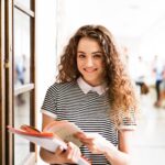 Teen girl holding books