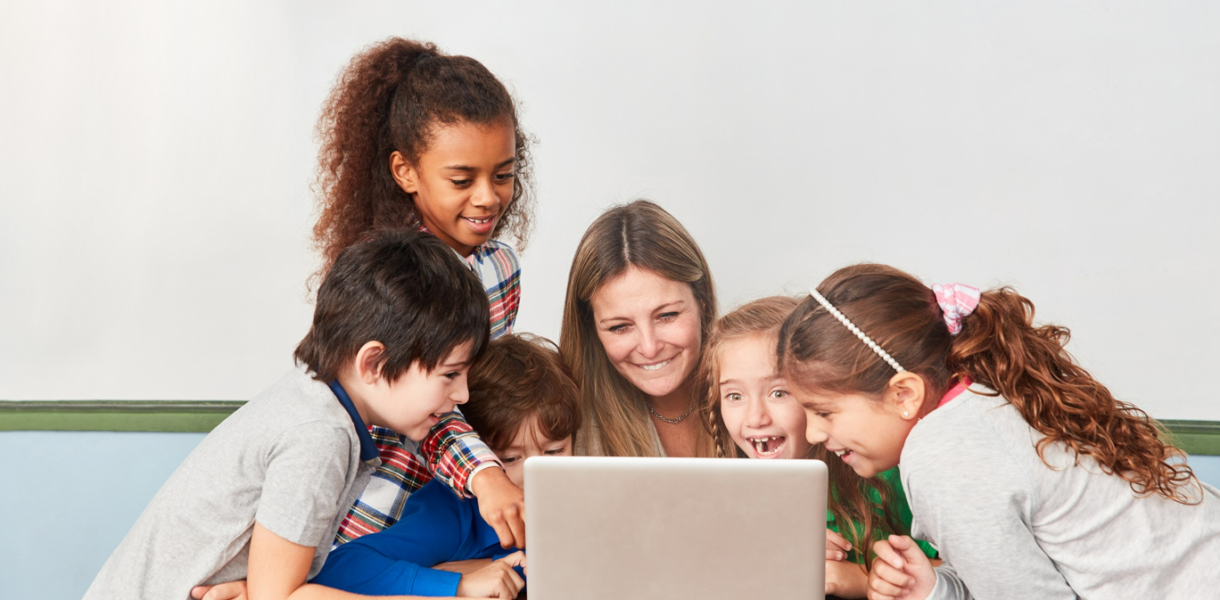 Teacher and kids on laptop