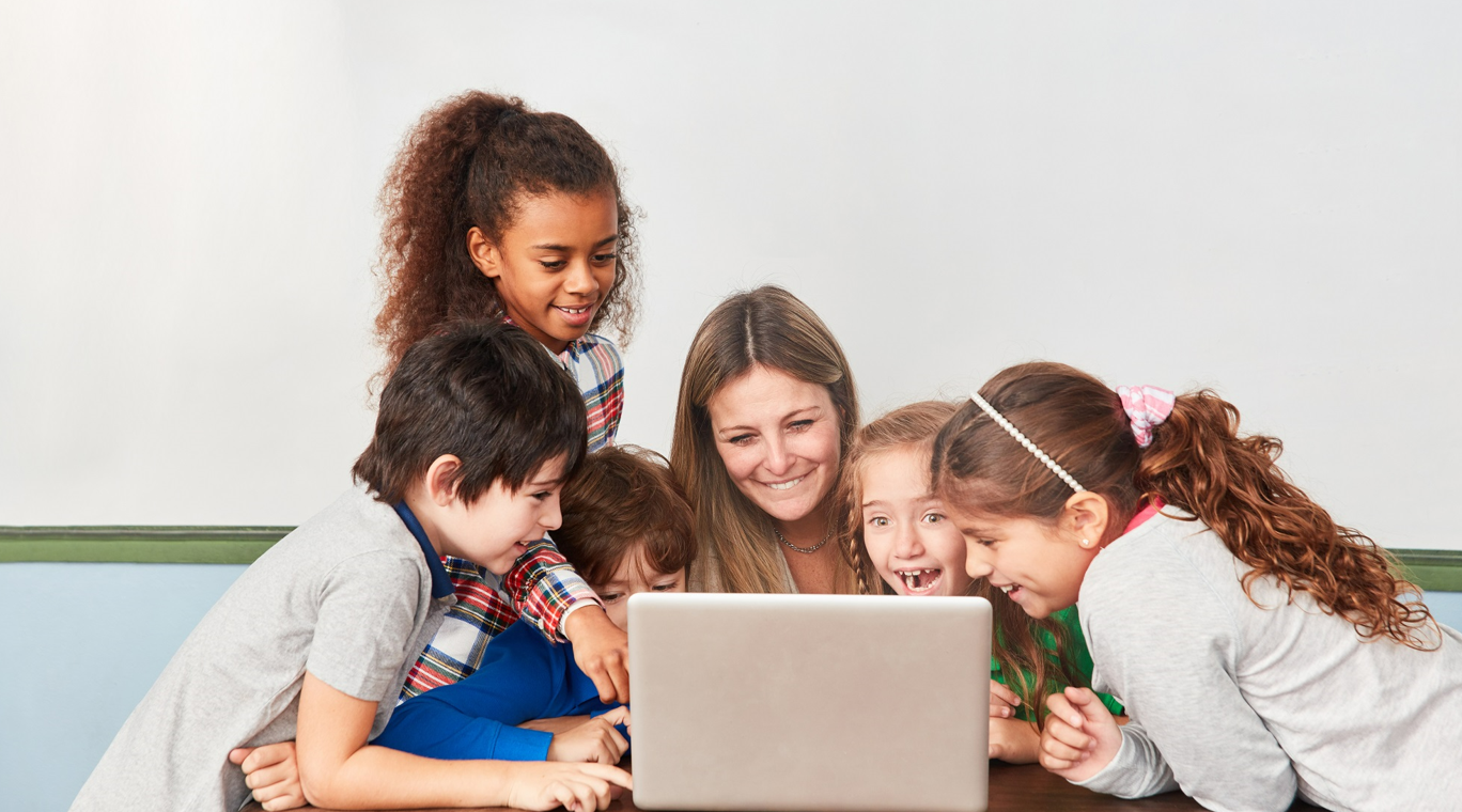 Teacher and kids on laptop